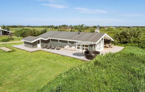 an aerial view of a house with a grill at Stunning Home In Ringkøbing With Sauna in Ringkøbing