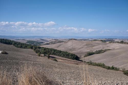 a view of a field with hills and trees at Relaxing Margherita Home Private Garden - Happy Rentals in Bucine