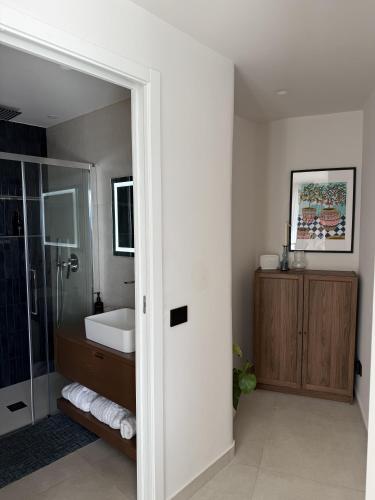 a bathroom with a shower and a sink at Villa Ada in Taormina