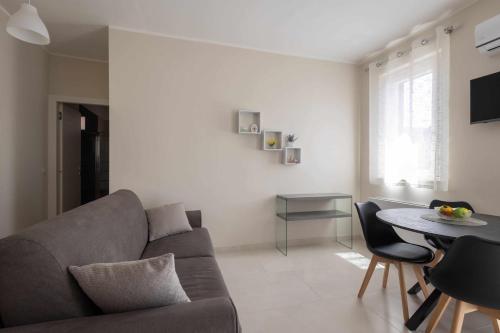 a living room with a couch and a table at Leaf - ApartHotel 2 in Delia