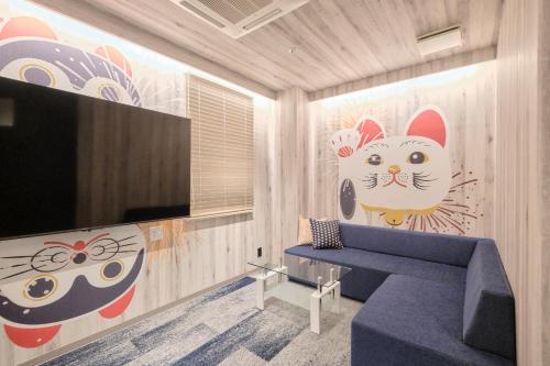 Una televisión o centro de entretenimiento en Nagoya Hotel HOQA Hanaironoyu