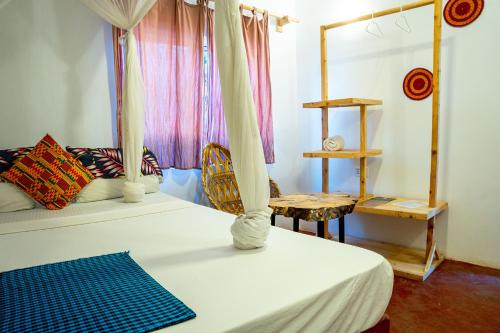 Postel nebo postele na pokoji v ubytování Dan Stam Hotel