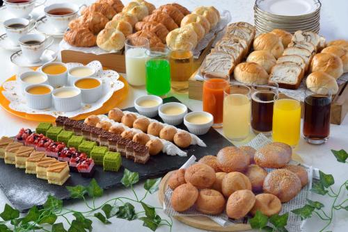 a table filled with different types of bread and pastries at Tokyo Bay Ariake Washington Hotel in Tokyo