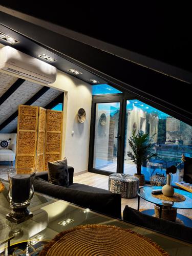 a living room with a view of the city at Sofita La Vita in Preveza