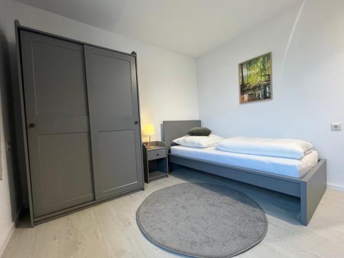 a bedroom with two beds and a closet at Truckcenter Fehrbellin an der A24 in Fehrbellin