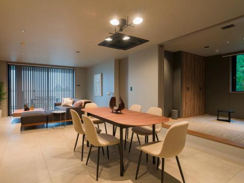 a dining room and living room with a table and chairs at Rakuten STAY TERRACE Hakone Kowakudani in Hakone