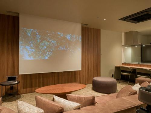 a living room with a couch and a table at Rakuten STAY TERRACE Hakone Kowakudani in Hakone