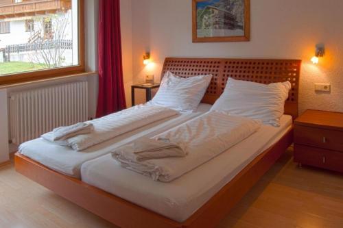 Ένα ή περισσότερα κρεβάτια σε δωμάτιο στο Chalet Alber