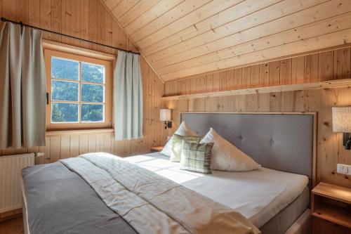 Ένα ή περισσότερα κρεβάτια σε δωμάτιο στο AlpenParks Hagan Lodge Altaussee