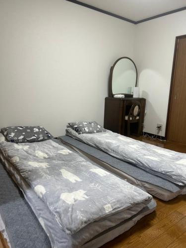 Cama o camas de una habitación en 金の森民泊