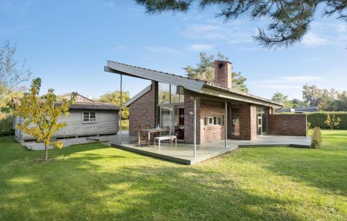 a brick house with a deck and a patio at Stunning Home In Vordingborg With Wifi in Vordingborg