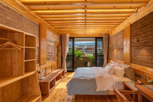 Ένα ή περισσότερα κρεβάτια σε δωμάτιο στο Shaxi Upstay