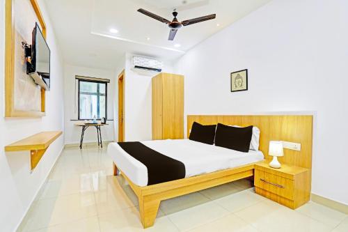 Postel nebo postele na pokoji v ubytování Super Hotel O Raipur