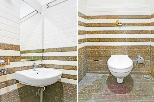 ラーイプルにあるSuper Hotel O Raipurのトイレと洗面台付きのバスルーム