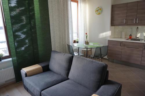 a living room with a couch and a table at Leongargt Apartments in Prague