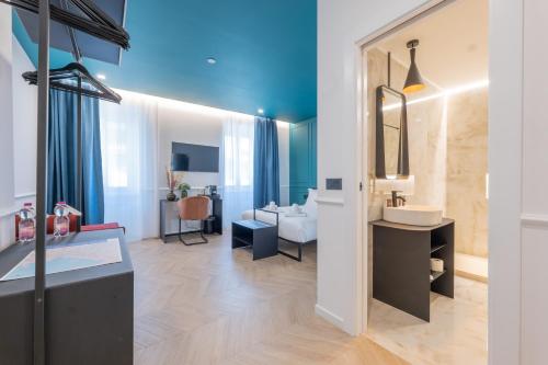 a bathroom with a sink and a mirror at Maria Cristina Boutique Rooms in Trieste