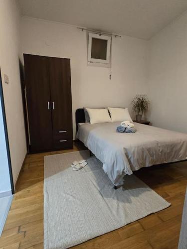 Ένα ή περισσότερα κρεβάτια σε δωμάτιο στο Grandma's place Zagreb