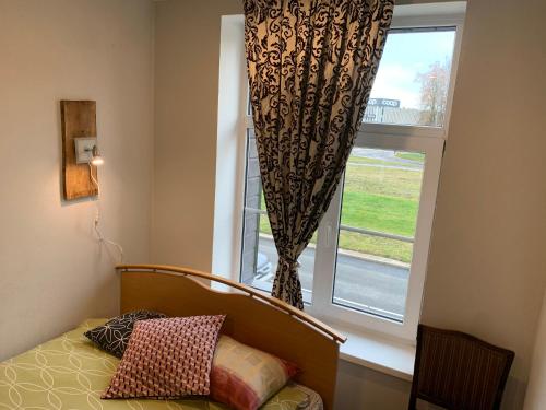 a bedroom with a bed and a window at Delta 6 two big beds in Tartu