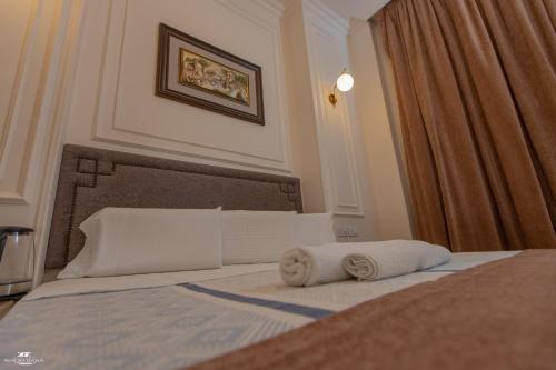 Ένα ή περισσότερα κρεβάτια σε δωμάτιο στο El Farida Hotel