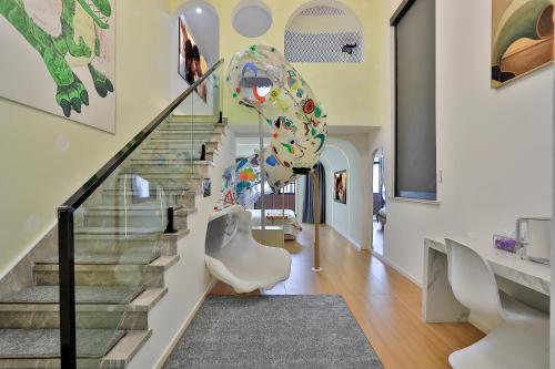 a staircase in a home with a glass stair case at 上海乡韵亲子酒店 in Shanghai