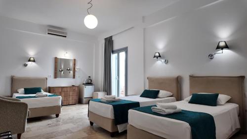Postel nebo postele na pokoji v ubytování Hotel Marybill