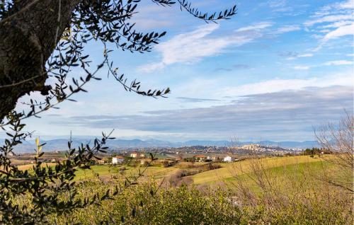 a view of a field with mountains in the distance at Amazing Home In Morrovalle With Wifi in Morrovalle