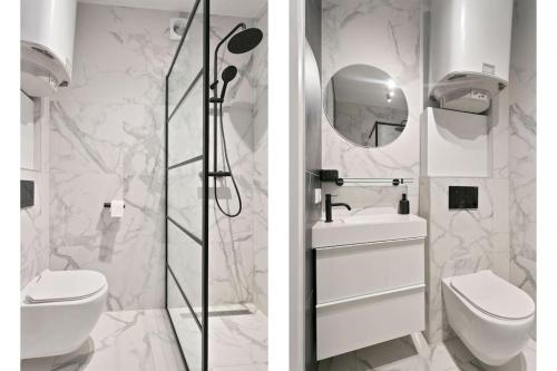 a bathroom with a toilet and a sink and a shower at Hoog C in Eindhoven