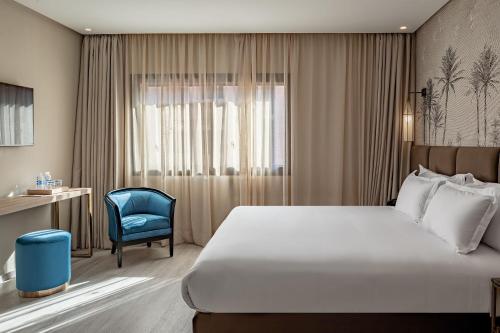 Ένα ή περισσότερα κρεβάτια σε δωμάτιο στο Grand Plaza Marrakech