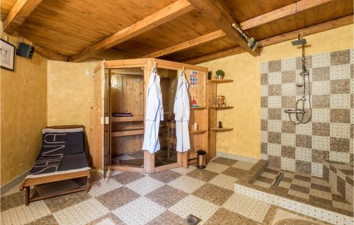 a room with a shower and a stall in a room at Gorgeous Home In Zgaljici With Sauna in Žgaljić