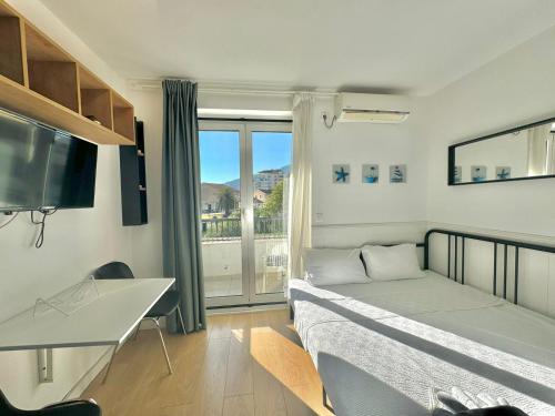 Postel nebo postele na pokoji v ubytování Apartmani Terminal