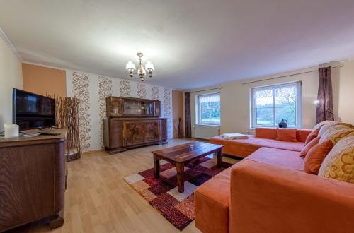 Posezení v ubytování Graureiher - Gemütliche Ferienwohnung mit Sauna, Bootsverleih & Naturerlebnis