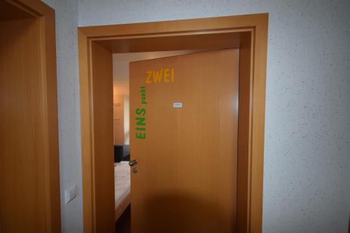 a door with the word zeki written on it at Nestwerk Komfort R23-12 - Balkon, Arbeitsplatz & Zentrumsnah in Biberach an der Riß