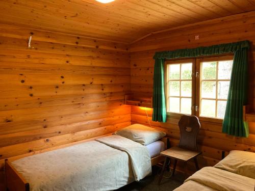 Postel nebo postele na pokoji v ubytování Chalet Glimuschir