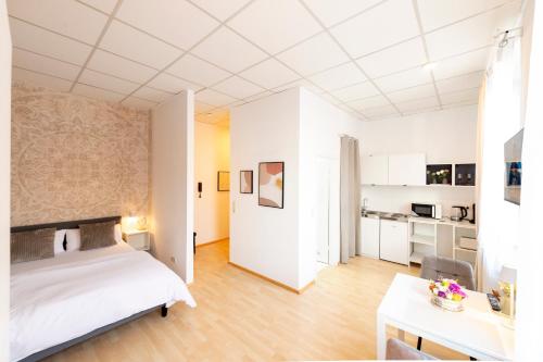 Ένα ή περισσότερα κρεβάτια σε δωμάτιο στο Galilei Apartment 1