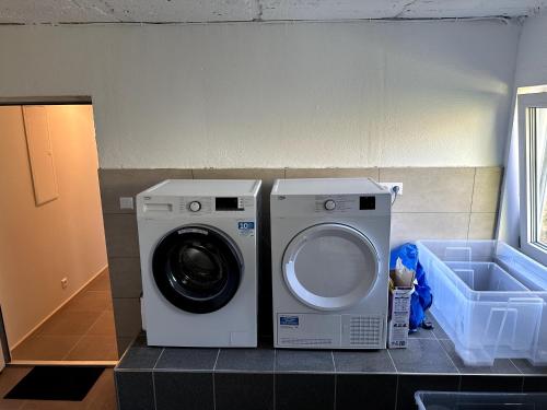 a washer and dryer on a counter in a room at Helfant Luxembourg Deluxe Double Room 2 in Palzem