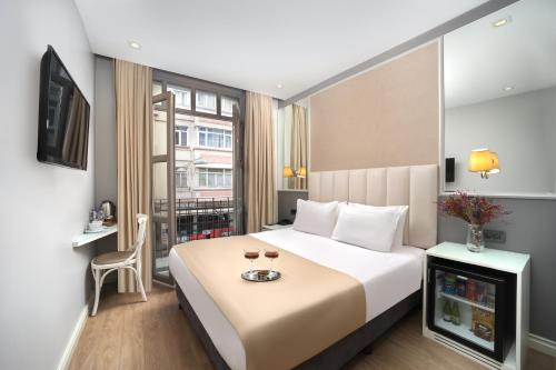 Postel nebo postele na pokoji v ubytování Ess Hotel