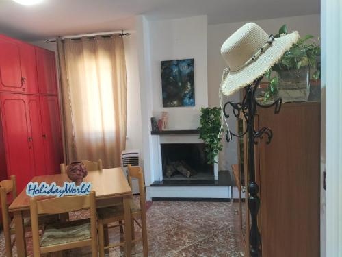 a dining room with a table and a microphone at Zopito's House by Holiday World in Loreto Aprutino