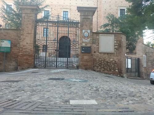 an entrance to a building with a wrought iron gate at Zopito's House by Holiday World in Loreto Aprutino