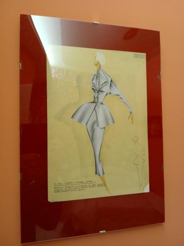 a framed picture of a woman in a dress at Dea Estia Alloggio Turistico in Tuscania