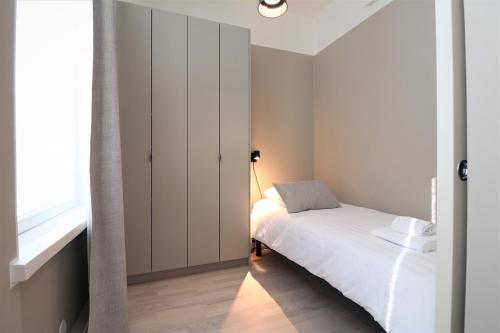 Katil atau katil-katil dalam bilik di Forenom Aparthotel Vaasa