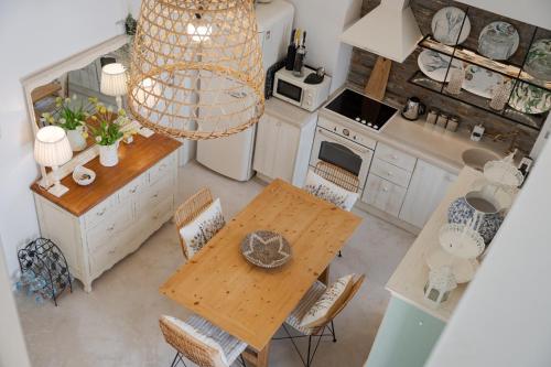 an overhead view of a kitchen with a table and chairs at Porto Sereno Andros Suites in Andros