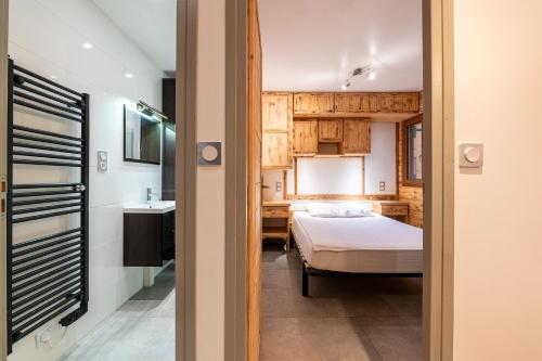 Ένα ή περισσότερα κρεβάτια σε δωμάτιο στο Appartement - Lanslevillard