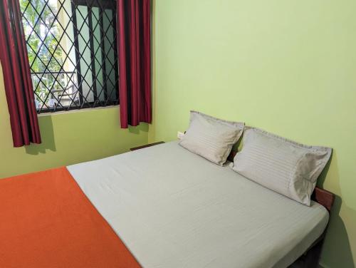 Katil atau katil-katil dalam bilik di Luciano Guest House