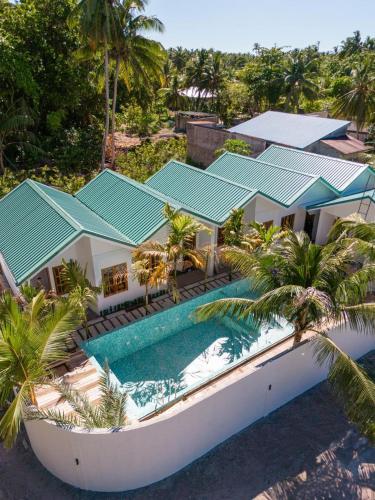 an aerial view of a house with a swimming pool at Kondey Villas in Kondey