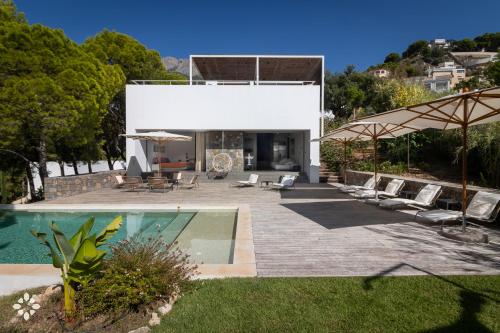 a house with a swimming pool and a patio at Villa EL Azahar by Abahana Luxe in Altea la Vieja