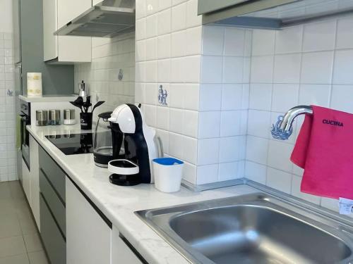 a kitchen with a sink and a mixer on a counter at House of Sun - beach at 400m, in Albenga Liguria in Albenga