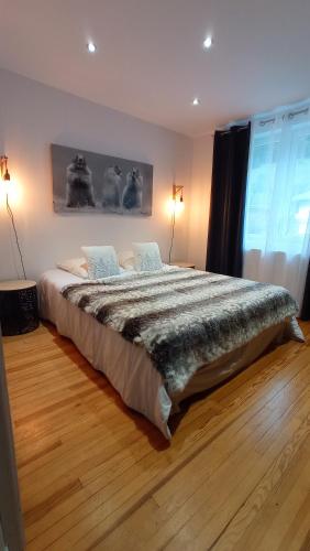 a bedroom with a large bed in a room at Sublime Chalet 14 Pers Spa Extrieur in Cauterets