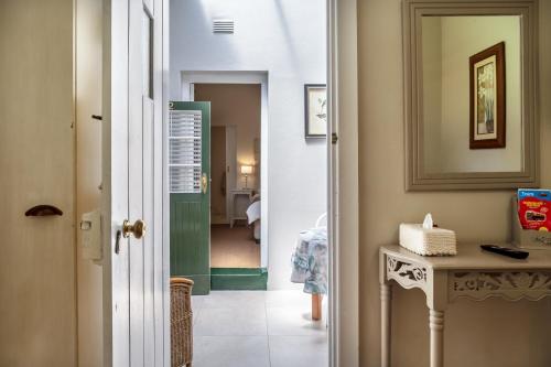Ένα ή περισσότερα κρεβάτια σε δωμάτιο στο Sandown Lodge