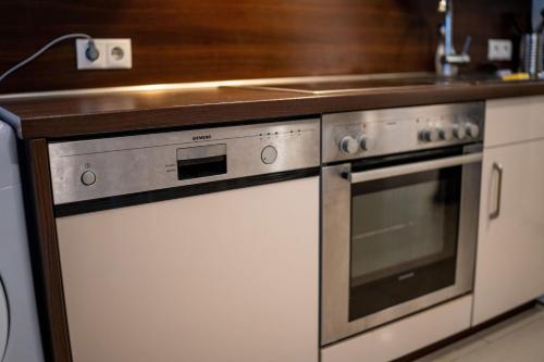 a kitchen with two ovens and a counter at Monteurwohnung - Cityapartment in Worms