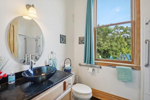 a bathroom with a sink and a mirror at The Starlight Tower Manor, River, Arcades, Observatory, Theater in Fort Atkinson